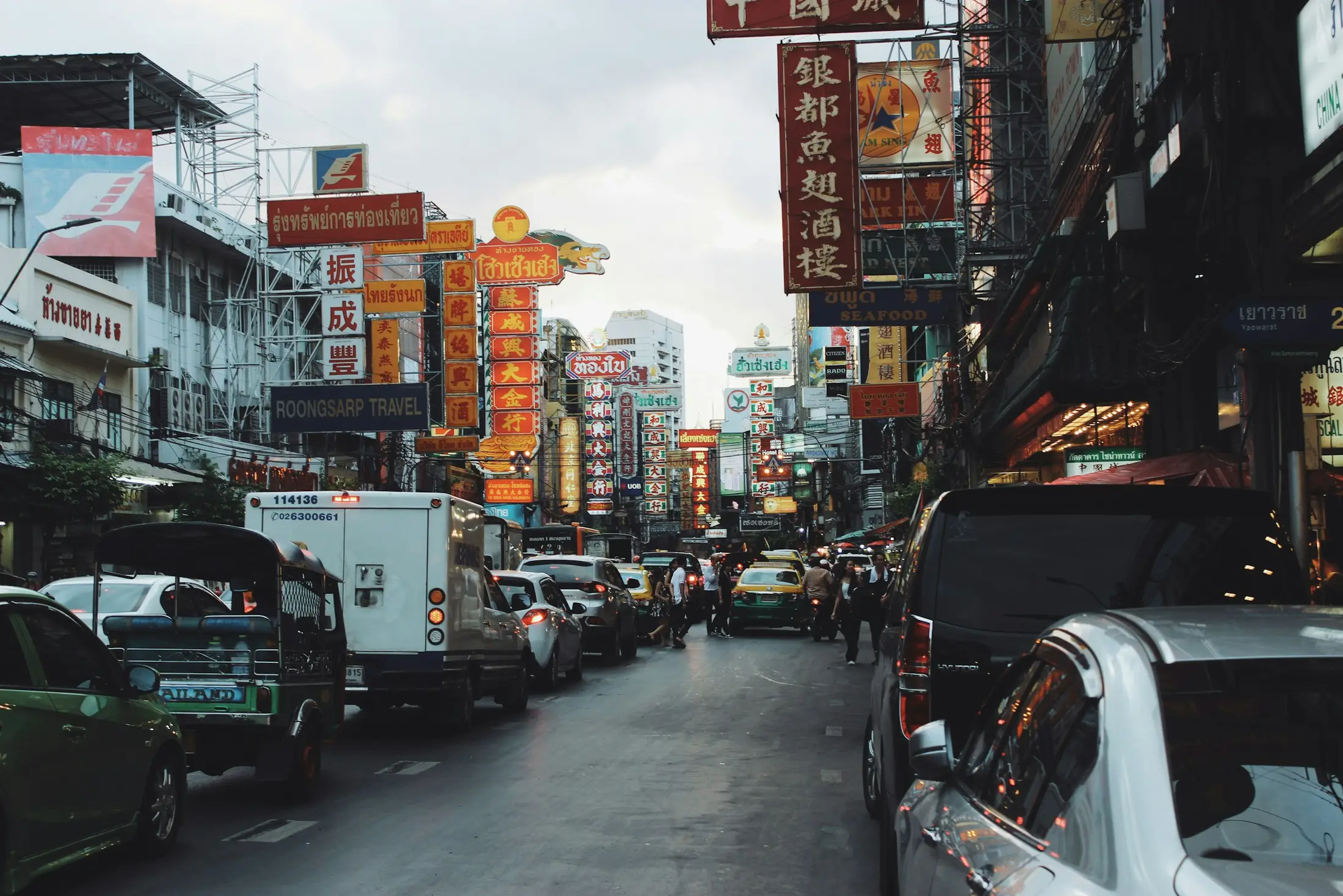 Daytime traffic and shophouses on Yaowarat Road