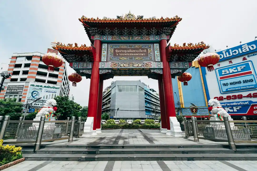 Bangkok Chinatown gate, temple incense, and traditional shops photo 2