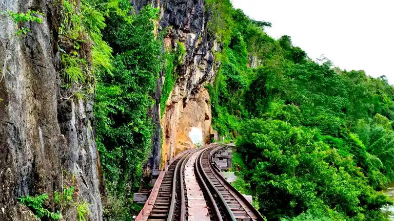 Death Railway tracks passing through a cliff cutting in Kanchanaburi