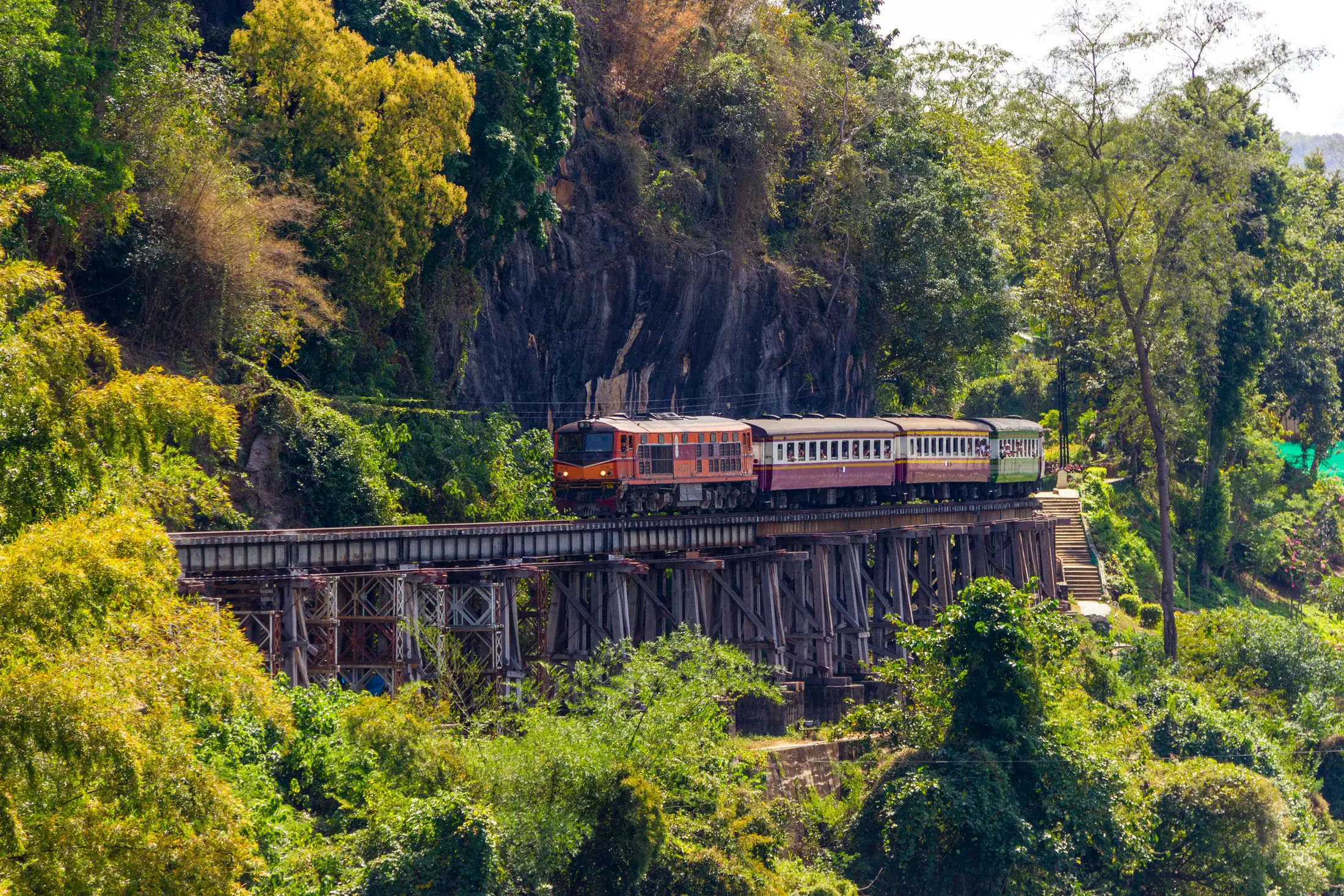 Train crossing the Death Railway beside the River Kwai in Kanchanaburi
