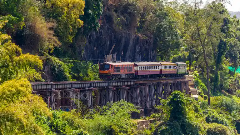 Train crossing the Death Railway beside the River Kwai