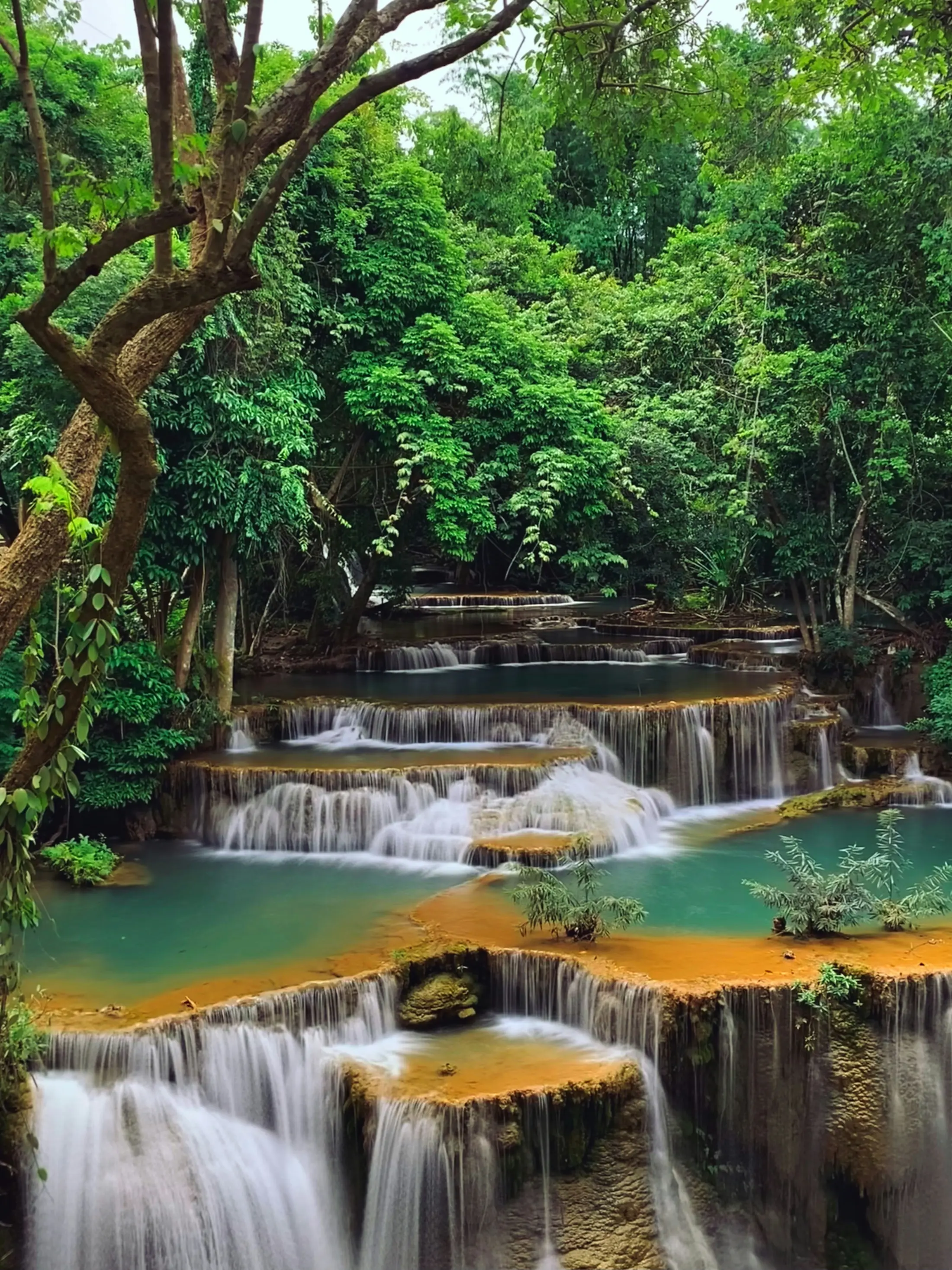 Tiered turquoise waterfall at Erawan National Park in Kanchanaburi