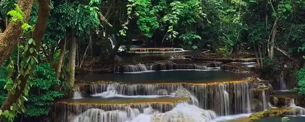 Tiered turquoise waterfall at Erawan National Park in Kanchanaburi