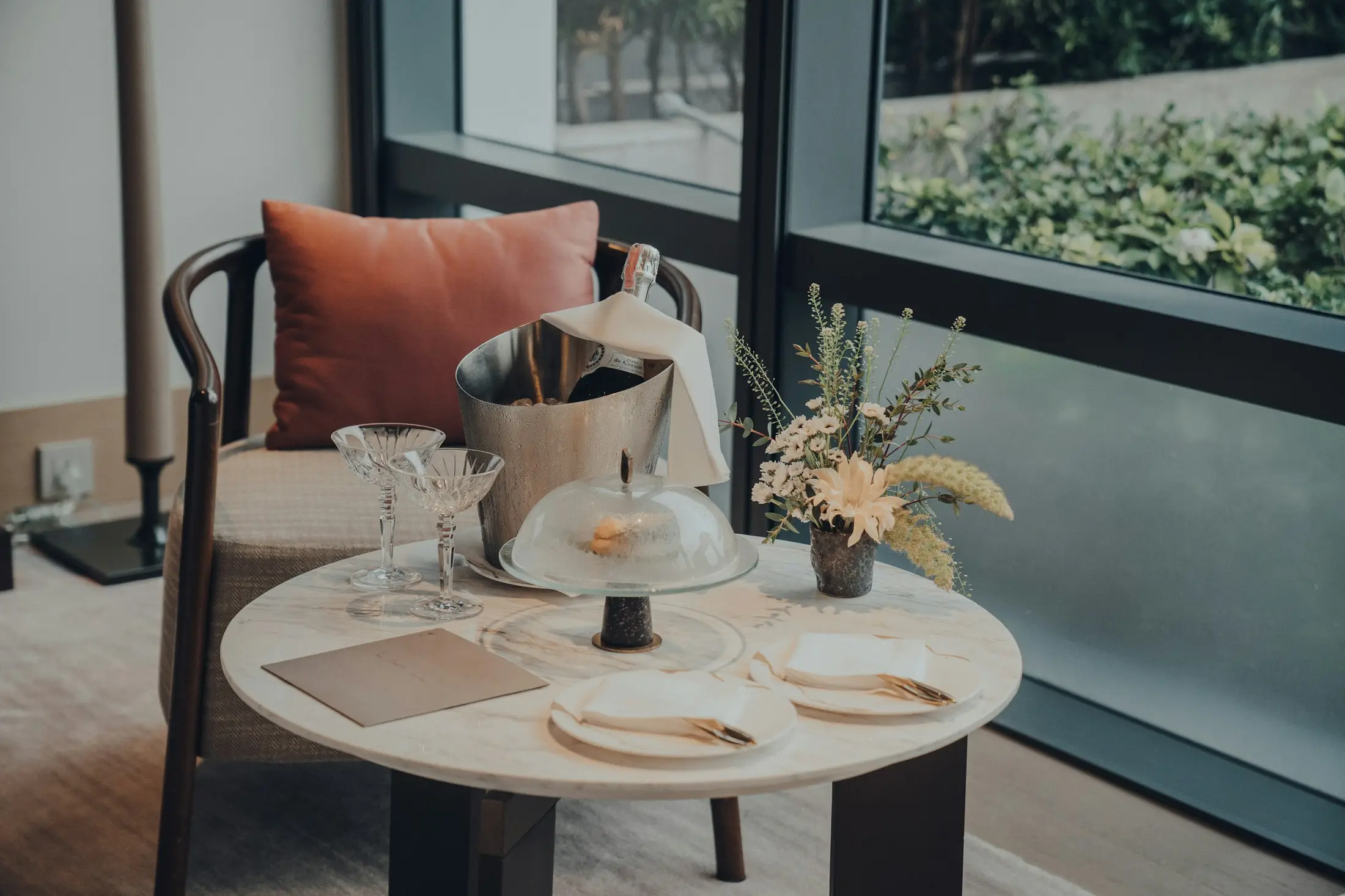 Fine dining table setting beside a Bangkok restaurant window