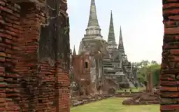Wat Phra Si Sanphet chedis seen through brick ruins in Ayutthaya