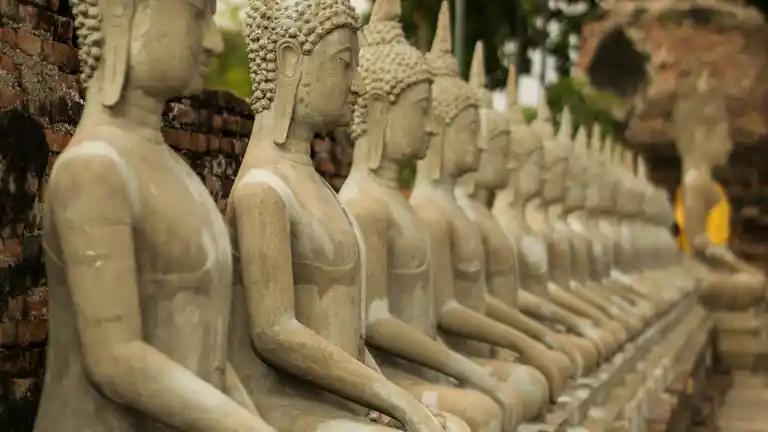 Rows of seated Buddha statues at Wat Yai Chai Mongkhon in Ayutthaya