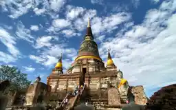 Large chedi and Buddha statues at Wat Yai Chai Mongkhon in Ayutthaya