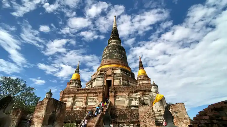 Large chedi and Buddha statues at Wat Yai Chai Mongkhon in Ayutthaya