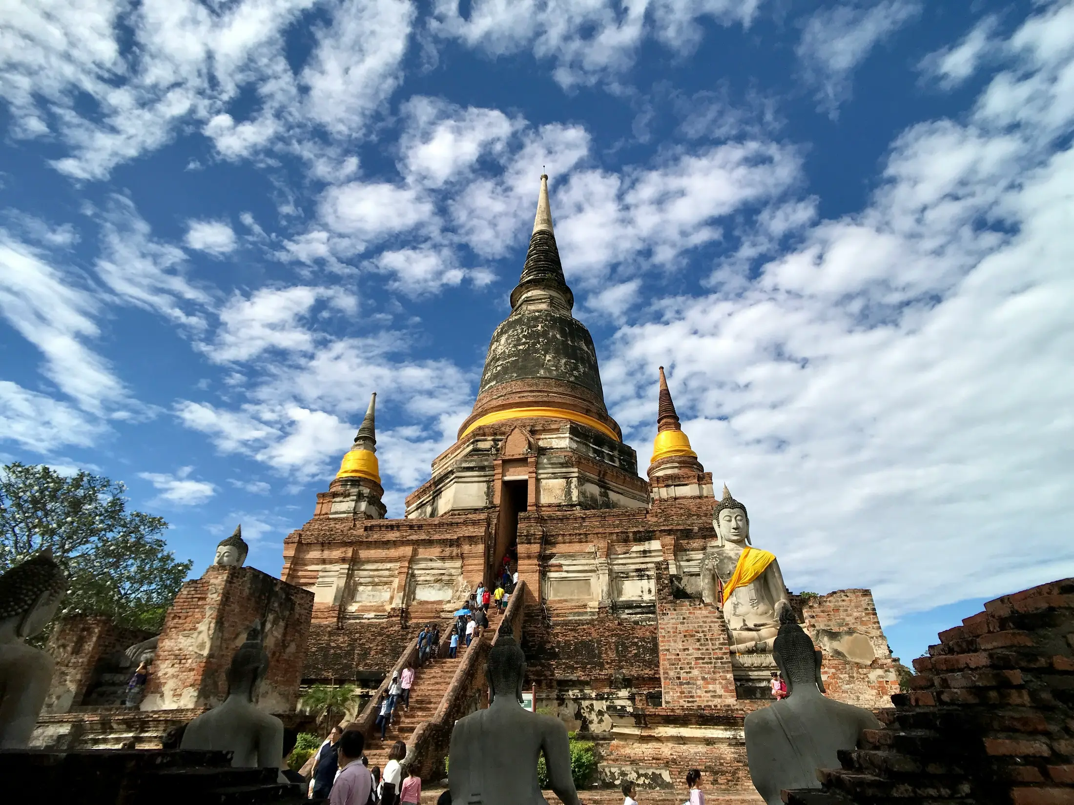 Large chedi and Buddha statues at Wat Yai Chai Mongkhon in Ayutthaya