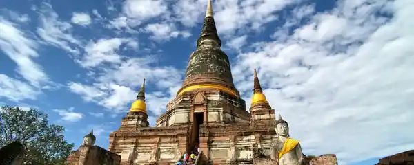 Large chedi and Buddha statues at Wat Yai Chai Mongkhon in Ayutthaya