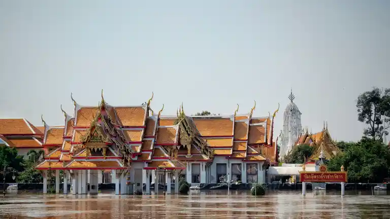 Ayutthaya temple buildings reflected in wet-season floodwater